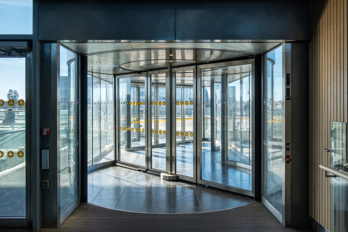 Front revolving transparent automatic rotate door in the airport