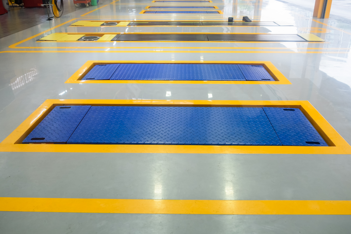 Parking car repair lift in garage blue yellow